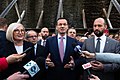 Prime Minister Mateusz Morawiecki surrounded in the back by SOP officers