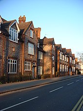 A row of brick and stone fronted buildings