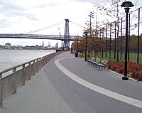 The promenade along the East River opened in 2010; the Williamsburg Bridge is in the background