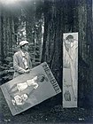 Sterling, posing with caricatures of himself at the Bohemian Grove, 1907