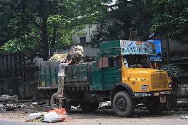 A garbage truck in Kolkata intricately decorated with Indian truck art