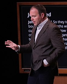 Mark Driscoll preaching at Mars Hill Church, set against a large projected image that reads "Ten Commandments: set free to live free"