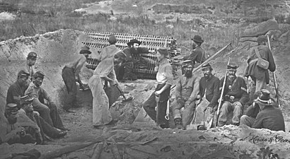 A Union sapper or combat engineer group digs a trench in the direction of an enemy fortification. A gabion provides cover from enemy fire. At Port Hudson a sugar hogshead stuffed with cotton or a cotton bale would serve the same purpose.