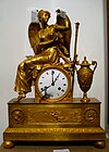 Empire revival timepiece (2nd half 19th century) with the figure of the goddess Aurora. Replica of a preexisting model.
