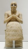 The Statue of Ebih-Il; c. 2400 BC; gypsum, schist, shells and lapis lazuli; height: 52.5 cm, width: 20.6 cm; discovered by André Parrot at the Temple of Ishtar (Mari, Syria); Louvre