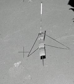 Genesis Rock in situ on the lunar surface prior to sampling (left of the gnomon, which was used for scale in the photos)