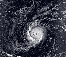 A satellite image of a hurricane in the Central Pacific Ocean, with a circular cloud pattern and clear eye