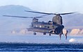 A 160th SOAR(A) MH-47 conducts water insertion of Marine Raiders