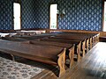 Unlike most churches, the pews are divided down the center by a wooden panel.