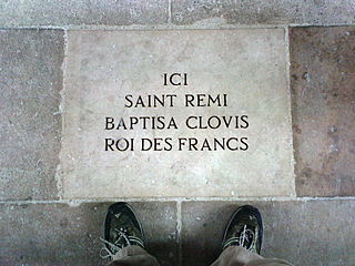 Paving stone in cathedral nave commemorating baptism of Clovis by Saint Remi