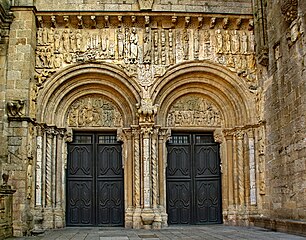 The Porta de Praterías, Cathedral of Santiago de Compostela, by Master Esteban, has two wide openings with tympanums supported on brackets. The sculptured frieze above is protected by an eave on corbels.