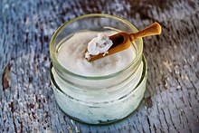 Coconut oil on a wooden spoon