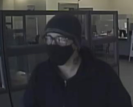 The Piggy Bank Bandit during a bank robbery on December 1, 2020