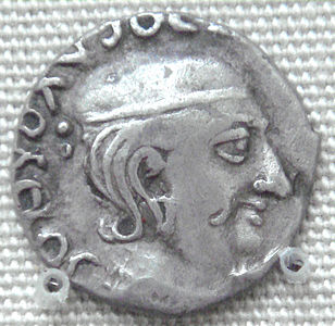 Rudradaman I coin, with corrupted Greek legend, at the British Museum.