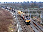 A freight train on the West Coast Main Line near Nuneaton in Warwickshire, England
