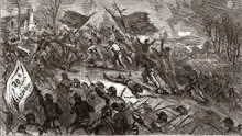A black and white drawing of soldiers capturing several cannons in front of a house. The soldiers in the foreground carry a flag that reads "20th Wisconsin"