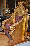 Throne; by Bernard Poyet and François-Honoré-Georges Jacob-Desmalter; 1805; carved and gilded wood, covered in red velvet with silver embroidery; 160 x 110 x 82 cm; Musée des Arts Décoratifs (Paris)[13]