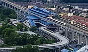 An aerial view of the USJ 7 LRT Station, with the Sunway BRT Line guideway making a loop with a stop beneath the station.