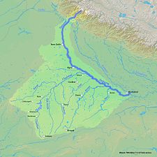 The Yamuna is the second-largest tributary river of the Ganges and the longest tributary in India. It flows almost parallel to the Ganges about its right bank for 1,376 kilometres (855 mi) before merging with it at the Triveni Sangam, Allahabad.