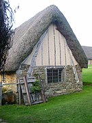 Cruck framing can be built with half-timber walls. This house is in the Ryedale Folk Museum in England.