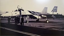 A large fighter plane on the tarmac