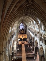 Nave of Lincoln Cathedral. showing three levels; arcades (bottom); tribunes {middle} and clerestory (top).