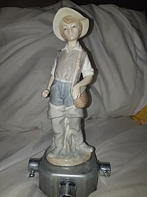 A Lladró Fisher Boy porcelain figurine