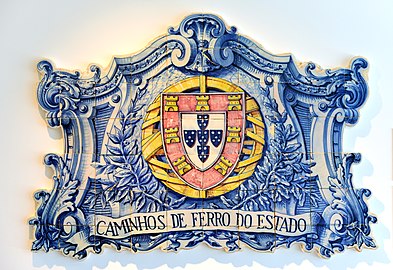 20th century coat of arms painted on an azulejo panel at a train station