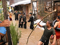 QC Reservists conduct rescue operations at Bgy Bagong Silangan, QC during the height of torrential rains brought by Southwest Monsoon in June 2011.
