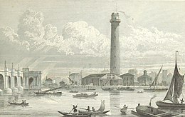 View from the northern bank of the Thames of the southern bank showing the shot tower, a thin, round building about seven floors high