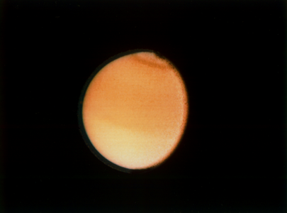 Another image of Titan taken by Voyager 2 on August 23, 1981, a few months after Voyager 1 arrived at Saturn first. The spacecraft was around 2,300,000 kilometres or 1,400,000 miles away from the moon.[225]