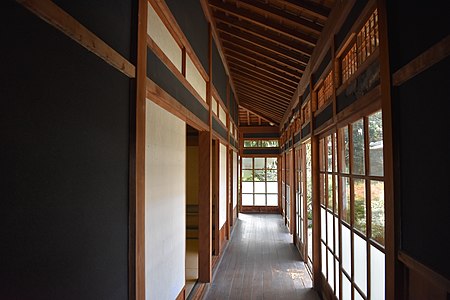 Engawa lined with paper-coated shoji (left, frame on inside) and surrounded by all-glass garasu-do (right). The lower glass is frosted.