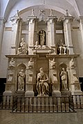 The tomb of Julius II, with Michelangelo's statues of Rachel and Leah on the left and the right of his Moses.