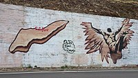 Modern street art of Icaria island and falling Icarus just outside the village of Evdilos on Icaria, Greece