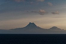 Isanotski (8,104 ft; 2,470 m) and Roundtop (6,128 ft; 1,868 m) volcanoes as seen from the Unimak Pass in the morning light.