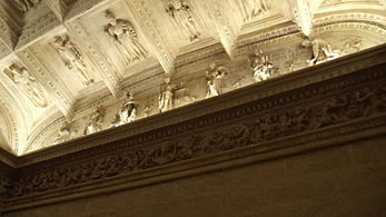 Reliefs in the lower chapter house of the Seville City Hall, where the virtues that should govern the public are represented. Justice is in the center.