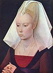 A woman of the Burgundian gentry in a "beehive" or perhaps truncated cone hennin, 1460s. Part of the veil comes forward to cover the eyebrows.
