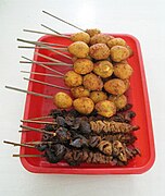 Skewered quail eggs and chicken offal satays in Indonesia