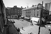 Black and white view of Shepherd Market, London, from an upper storey window
