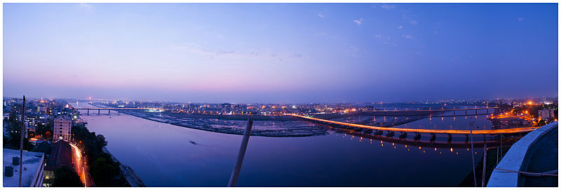 Panorama of Tapi river in Surat city at dusk with partial daylight and lights illuminated