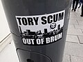 Sticker, stuck to a lamp post in Birmingham, displaying the words "Tory scum out of Brum"