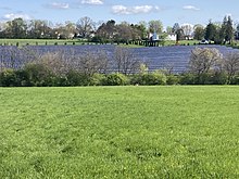 Green field with 12,000 solar panels