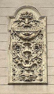 Arabesque with foliage spirals and a rectangular cartouche with the year when the house was built, on a corner of Strada General H.M. Berthelot no. 52, Bucharest, unknown architect, 1890
