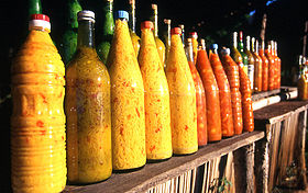 Bottles of yellow and orange sauce