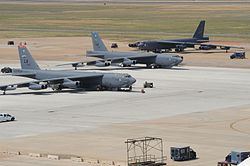 Three Boeing B-52H Stratofortress bombers sit on the flight-line at Barksdale Air Force Base in 2012.