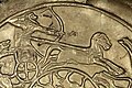 Hunter controlling his chariot from the waist, Ugarit, 15th-14th century BCE.[8]