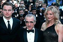 A photograph Leonardo DiCaprio with Martin Scorsese and Cameron Diaz (from left to right) surrounded by the paparazzi