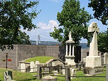 A present-day view of the cemetery with the George Washington Bridge visible in the background.