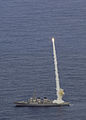 The guided-missile destroyer USS Curtis Wilbur launches a RIM-156 Standard SM-2 ER missile while conducting torpedo evasion maneuvers during Multi-Sail 2009