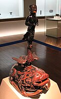 Lacquered yuren (羽人) figure on a toad stand from the Chu kingdom of the Warring States.